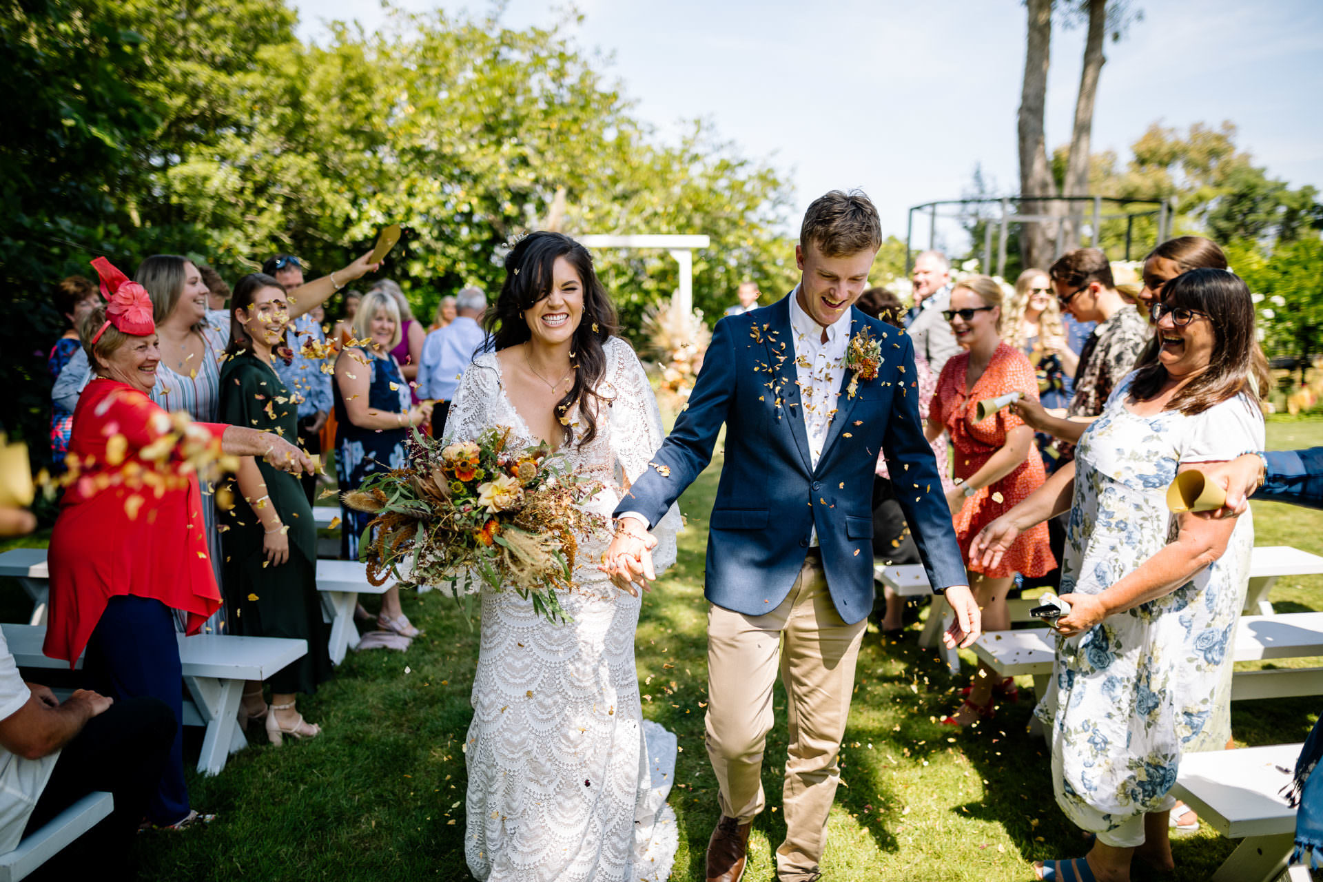 Bride and groom confetti isle photograph