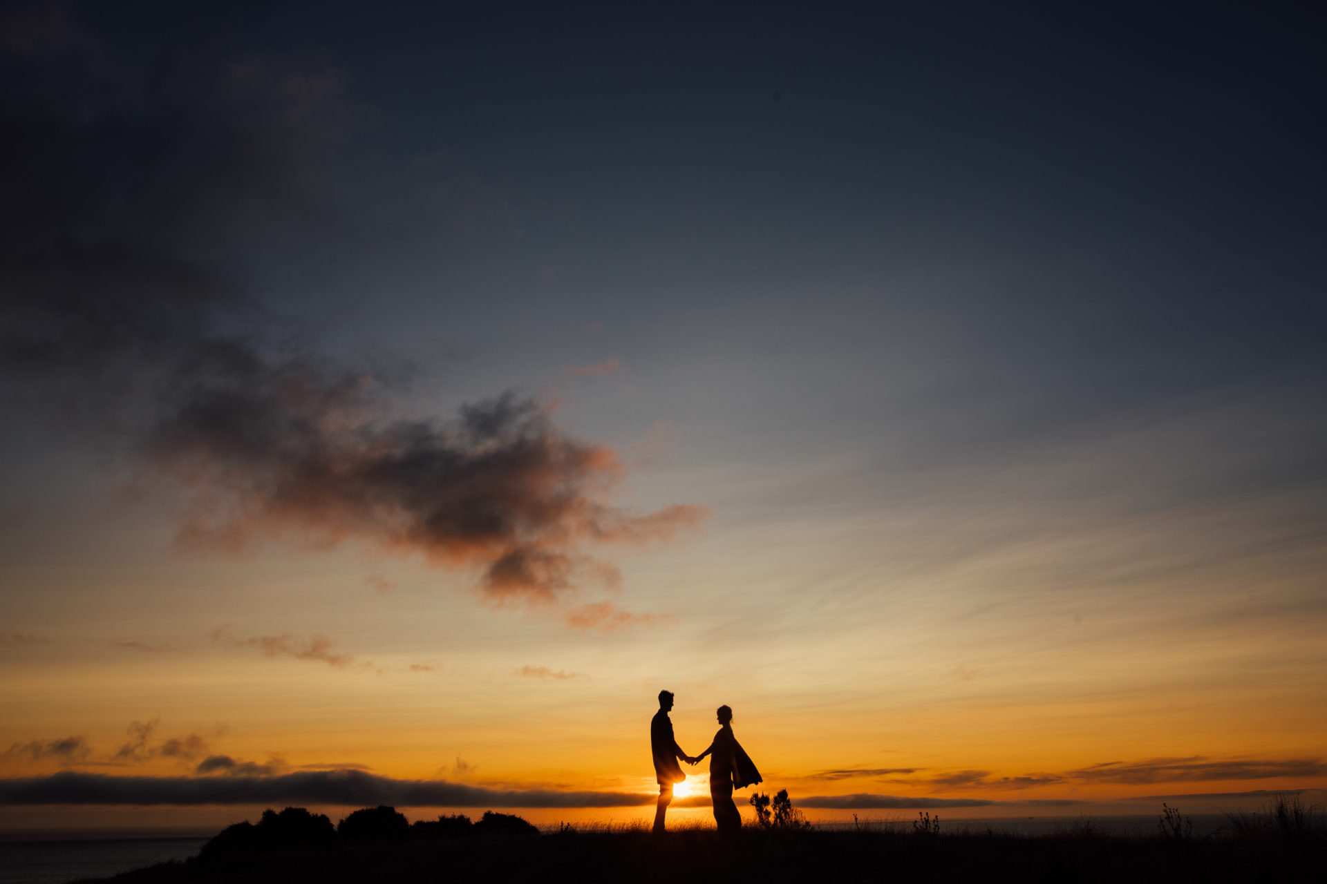 Wedding silhouette sunset photo with bride and groom