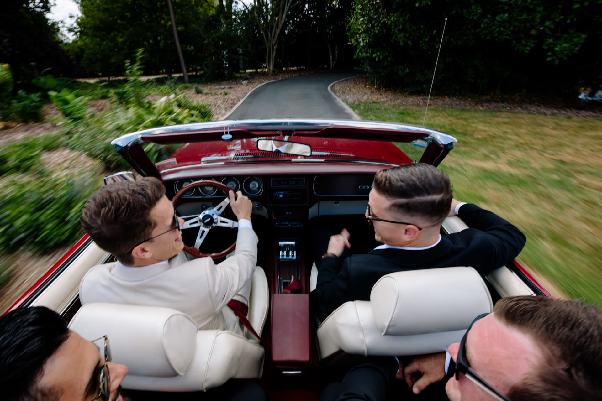Bridal car with groomsman