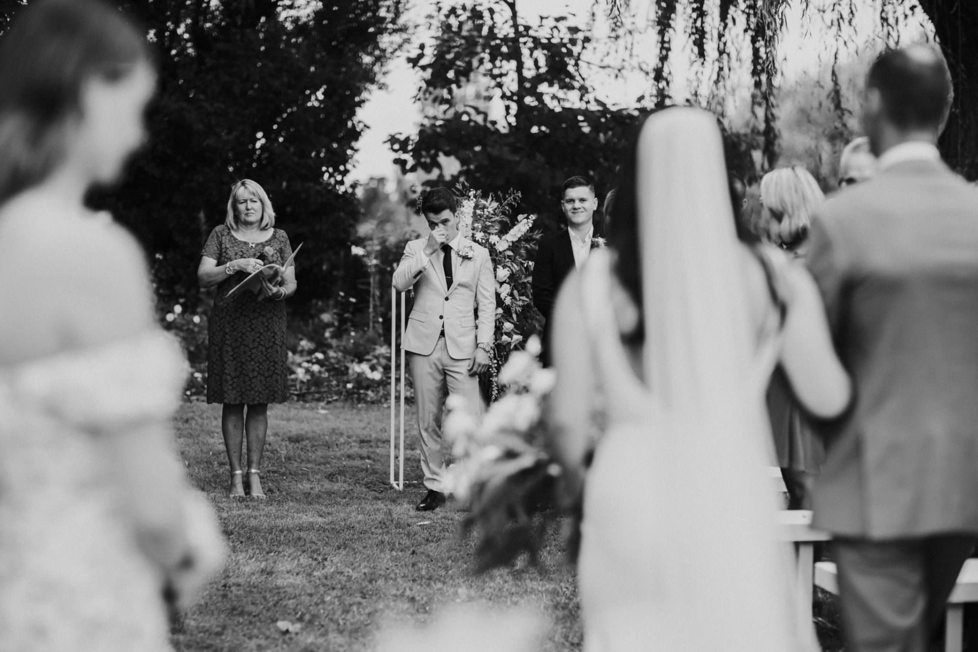 Groom reaction to bride coming down the isle